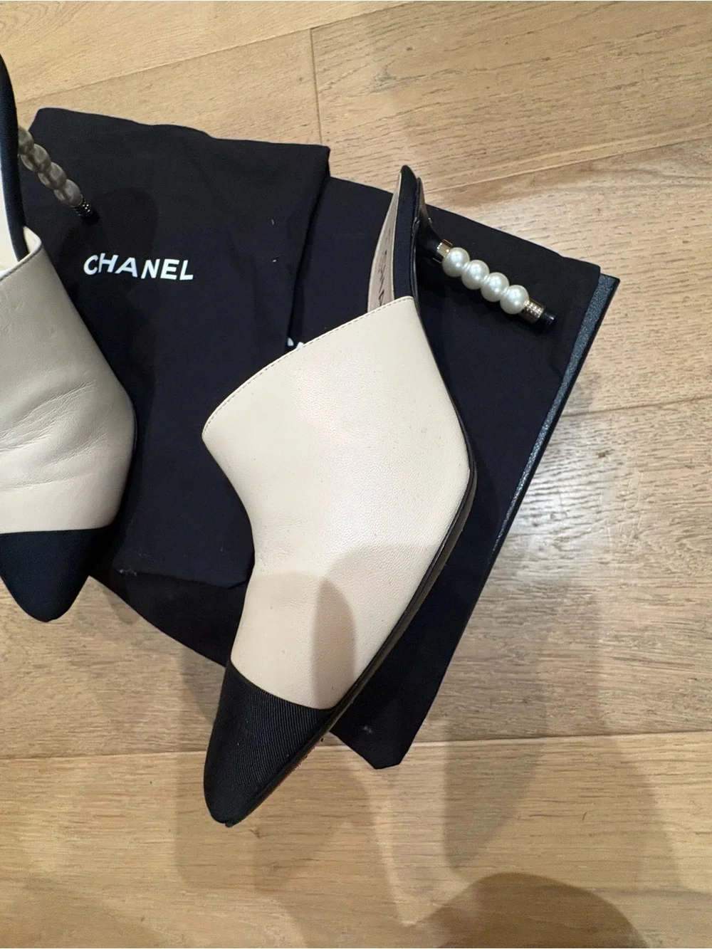 CHANEL Two-Tone Leather Mules with Pearl-Embellished Heel in White & Black